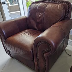 Brown leather chair, high end. Very, very comfortable.
