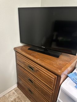 Wooden Dresser With Samsung Tv