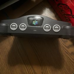 Nintendo 64 with controllers and game