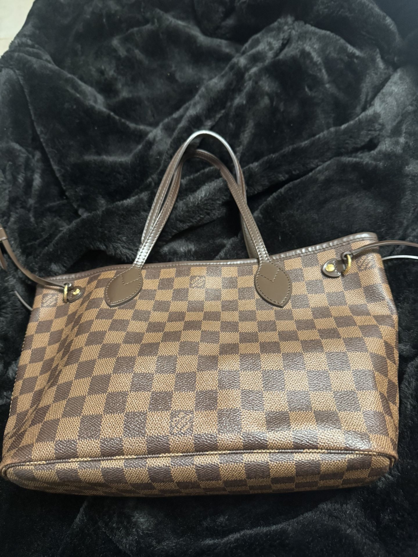 Louis Vuitton Neverfull PM tote bag in the Damier Ebene coated canvas