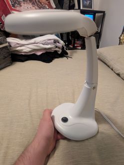 Table light with magnifying glass