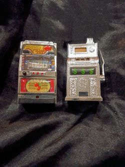 The all-metal, classic dollar-sign novelty slot machine piece shown in