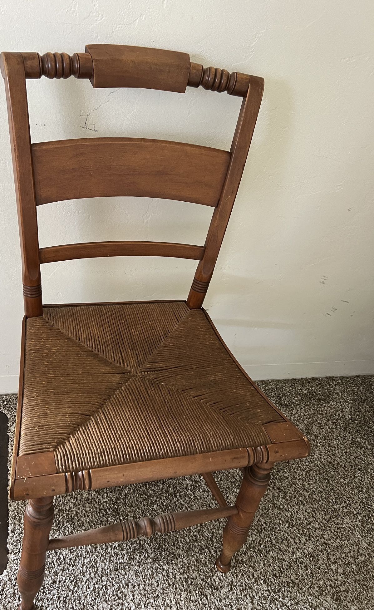 Antique Hitchcock-style chair with a rush seat