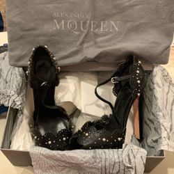Alexander McQueen black laser-cut leather platform heels featuring silver studs 