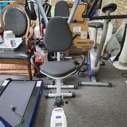 Indoor exercise bike with hand stretching device