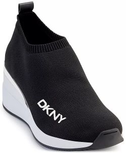 DKNY's Parks sneakers slip on with comfortable stretch while a sporty wedge heel lofts this active look to the next level in street-chic style.