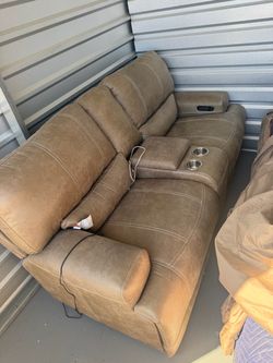 Power Reclining Sofa and loveseat with Console and Cup Holders