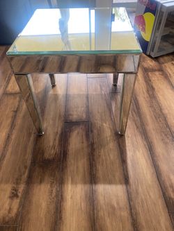 The glass table is a bit scratched, but it's not too bad.