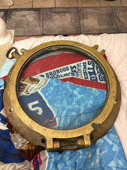 Vintage brass porthole from a salvaged ship