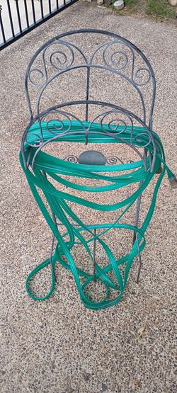 Rod iron water hose storage