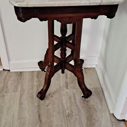 Victorian era, Eastlake style, marble top, parlor side table on casters,later 19th century,
