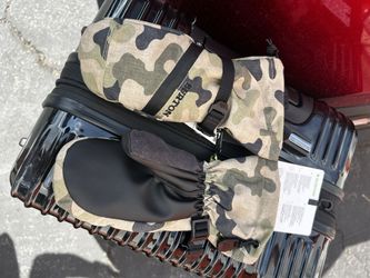 This is a Burton Vent Mitten in Olive Terra Camo, potentially from the Kids' line. 