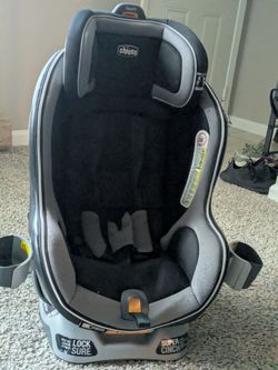 Chicco NextFit Zip Convertible Car Seat in a black and grey