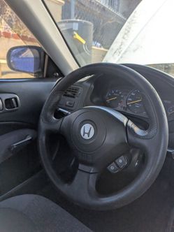 S2k steering wheel and OEM civic floor mat