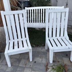 4 white wooden chairs