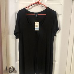 Womens Size Large Tunic Length Black Top Round Neck With Cris Cross Design.  Short sleeves color solid black.  See tag picture for the Cris Cross desi