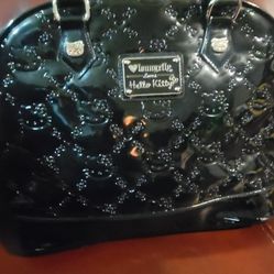 Loungefly Hello Kitty black patent satchel. This stylish handbag, a collaboration with Sanrio, features an all-over embossed design of Hello Kitty fac