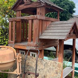 Children’s play structure with swing set and two slides