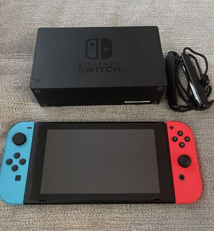 Nintendo switch with charger and extra joycon