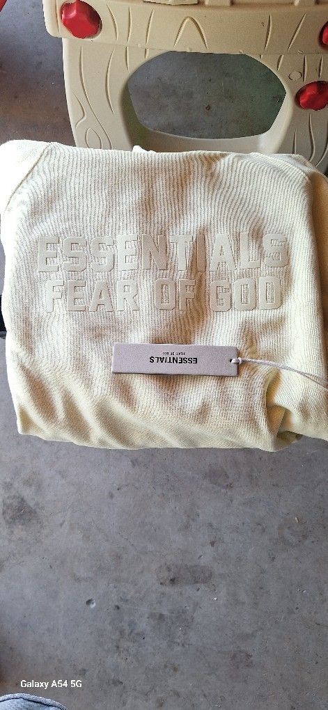 BRAND NEW π― AUTHENTIC FEAR OF GOD ESSENTIALS CANARY YELLOW HOODIE. PACSUN.