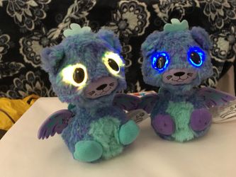 Two spin master Peacock Hatchimals batteries included