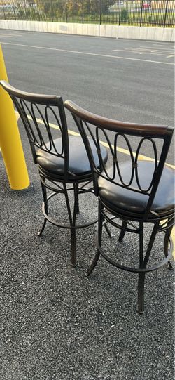 SET OF TWO HEAVY BROWN METAL SWIVEL BAR STOOLS