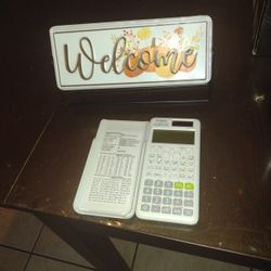 Calculator And Welcome Sign 
