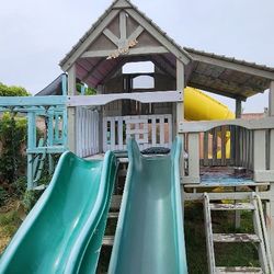 Playhouse/Sky fort,  Slides, Swings, Rock Wall