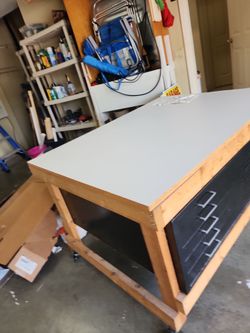 Artist work table. Multi drawer artist work table constructed by the artist. Plus two silk screens