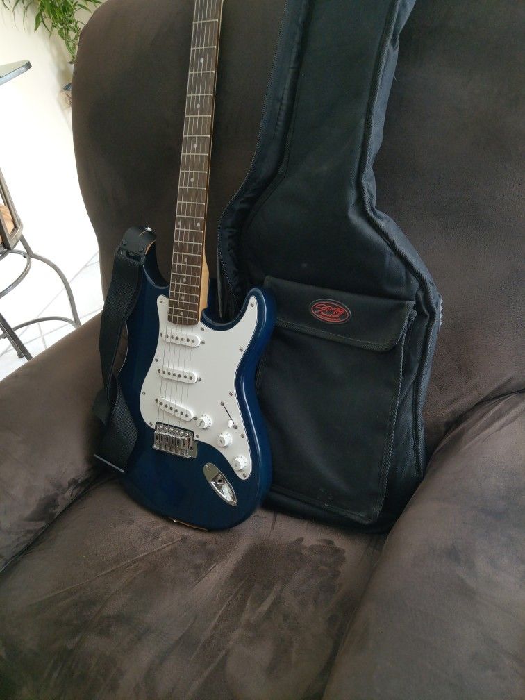 Blue J. Reynolds Electric Guitar With Shoulder Strap And Carrying Case