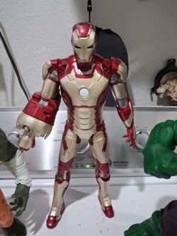Hasbro iron man 3 sonic blasting figure.  15 inches.  motorized right arm with sounds.   Good condition.
