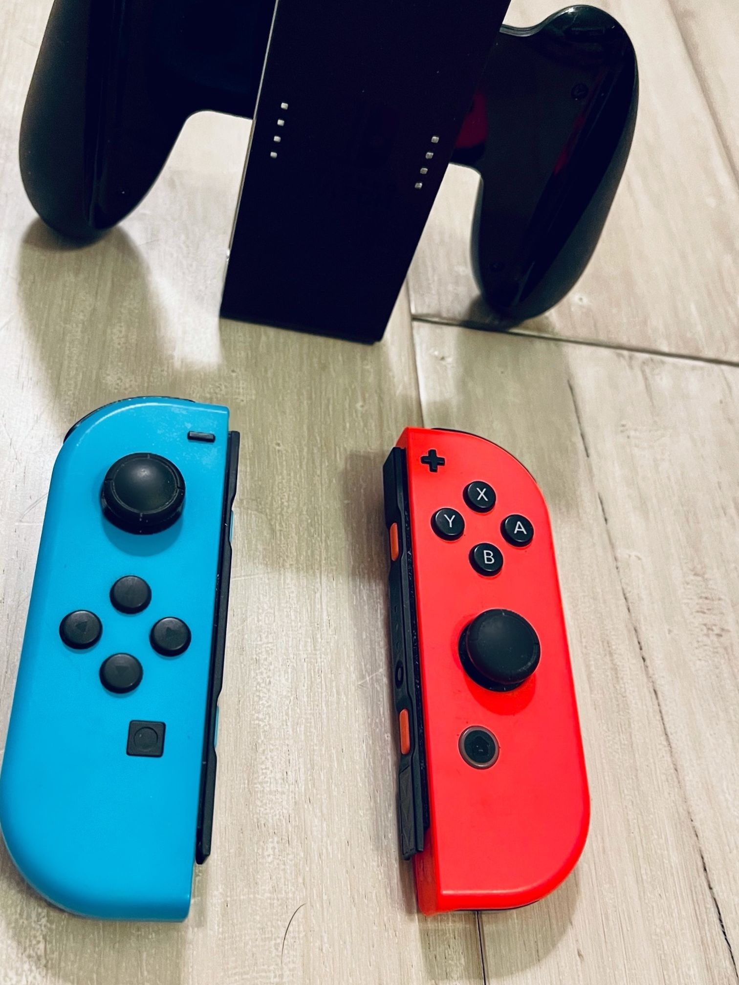Nintendo Switch Red And Blue Joycons with Joycon Holder