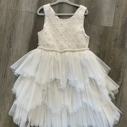 American Princess Girls Dress Size 6/7 Pink and white with pearl bead trim Excellent condition. Zips up in back and has a small belt that ties into a
