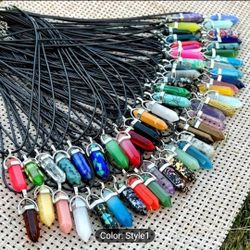 This 30-piece pendant set features colorful crystal stones in a pointed design, perfect for chakra healing. The black leather necklace adds a stylish 