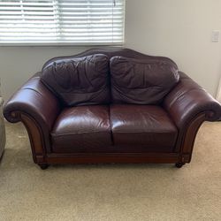 Beautiful Wine Red Leather Love Seat.