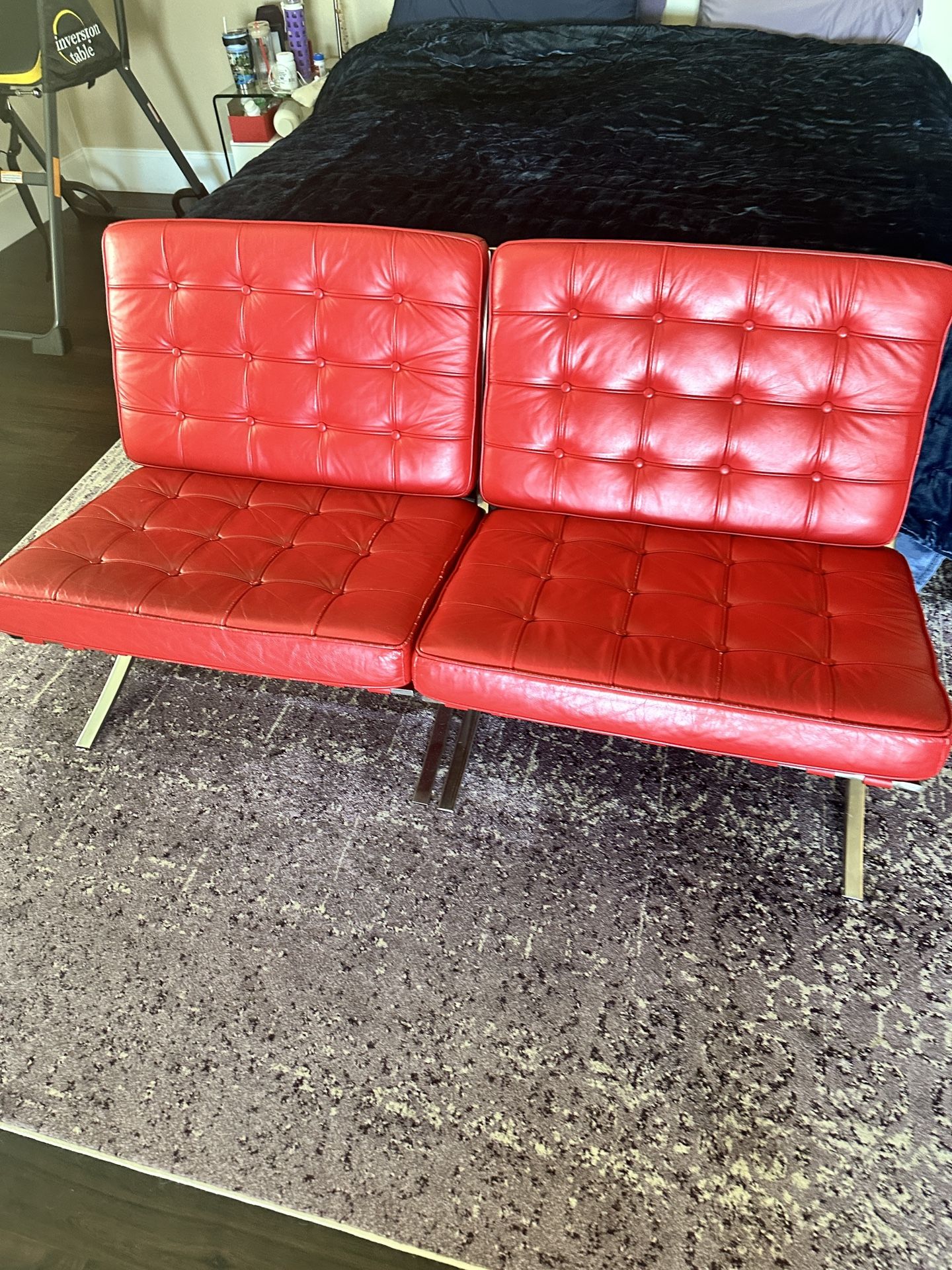 Two iconic Barcelona red leather chairs