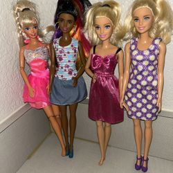 4 Barbie Dolls