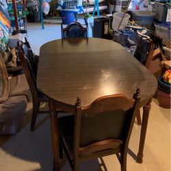 Oval Dark Brown Table With 4 Chairs 2 Leaves 48 “Without Leaves Total Length 68”