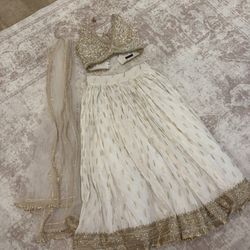 White and Gold wedding guest lehenga from Lashkaraa