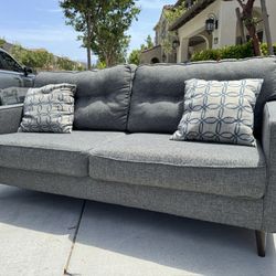 Grey Couch with 2 Pillows