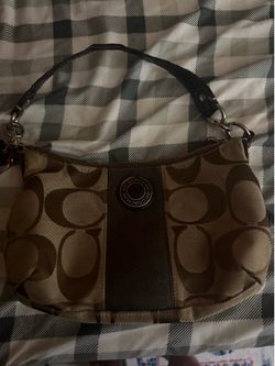 MOVING!!!!! Beautiful brown/ tan Coach purse. Good condition. Top of strap little flaw.