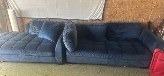 Velvet sofa with pillows