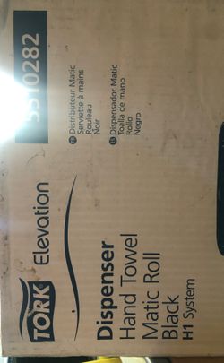 Tork hand towel dispenser in box