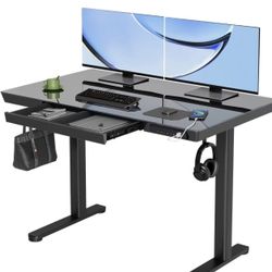 YDN Glass Standing Desk with Drawers, 48 x 24 Inch Electric Stand Up Desk with USB Ports, Adjustable Height for Home Office, Black $120 