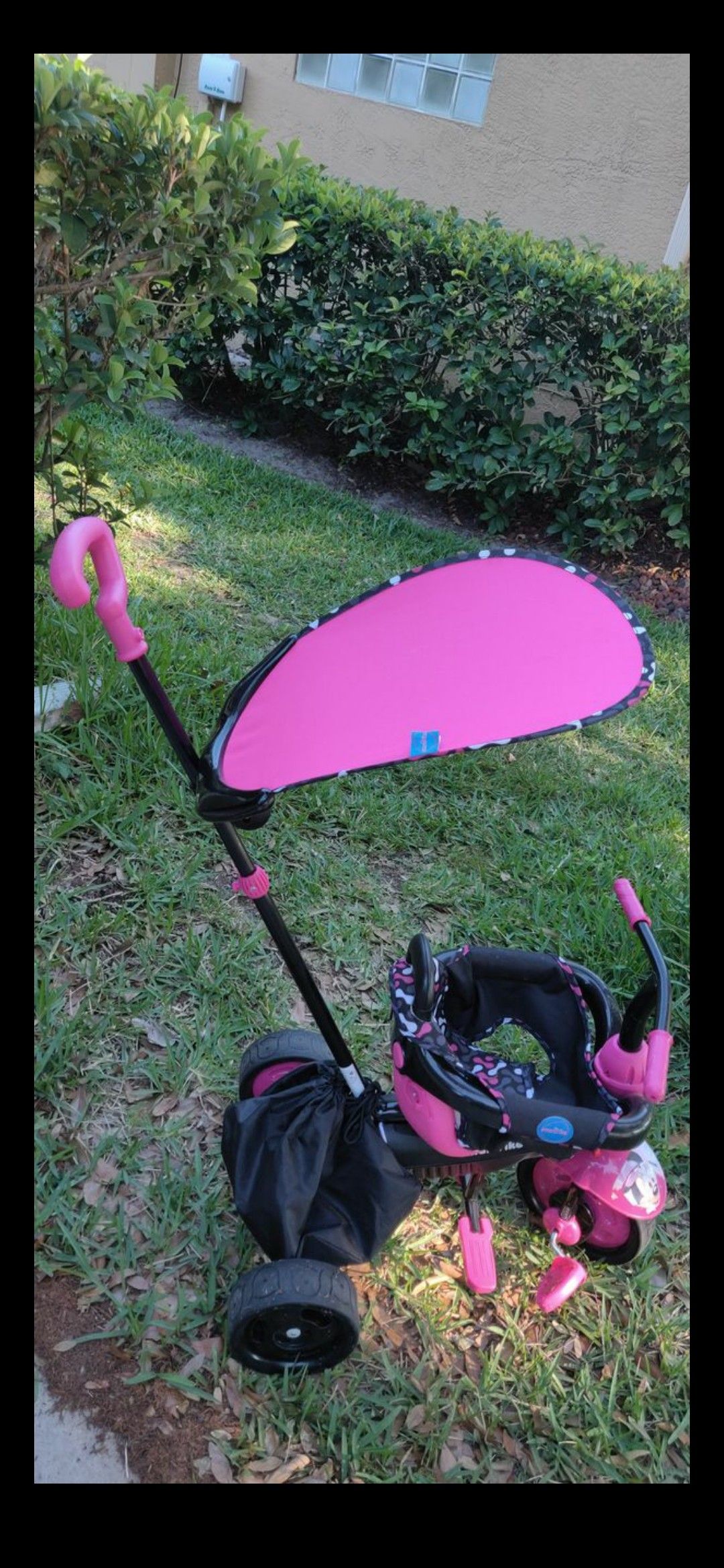 Pink Smartrike tricycle