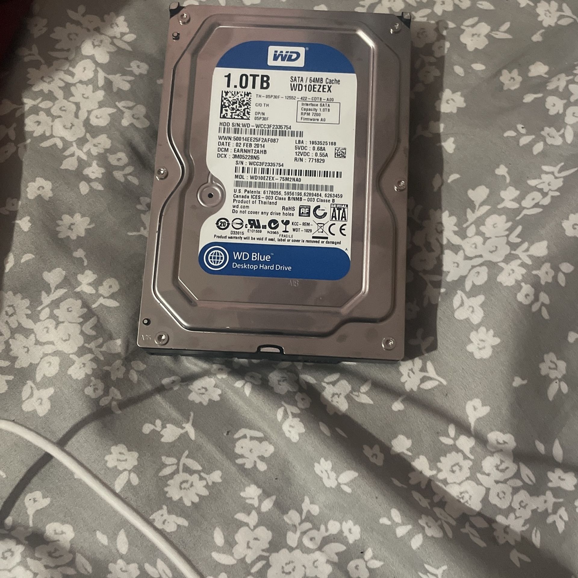 Western Digital Blue 1TB desktop hard drive with SATA interface and 64MB cache.
