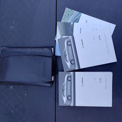 Set of 2008 Lexus ES 350 owner's manuals in a black faux leather case