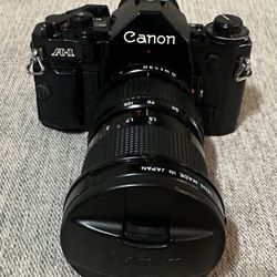 Canon A-1 35mm SLR Film Camera with 35-105 Canon Lens.