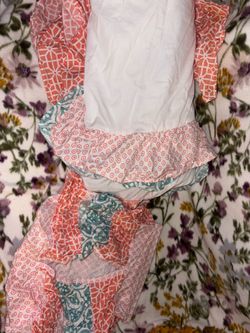 Crib dust ruffle skirt and diaper hanging caddy