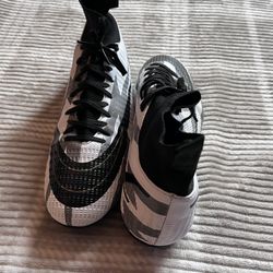 soccer/football cleats (firm ground boots).